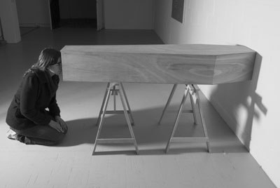 'you are here' sarah sparkes 2006 coffin built to fit artist, trestle tables and infinity box.